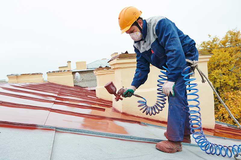 Pleasanton CA metal roof installation being painted red