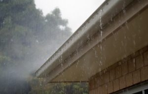 Overflowing gutters damaging roof in Pleasanton, CA.